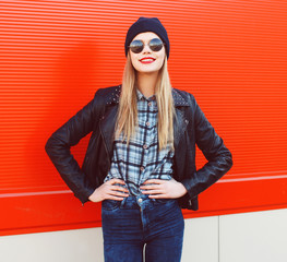 Portrait of fashionable blonde wearing a rock black style having
