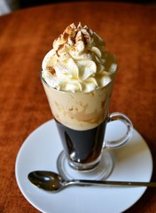 Viennese coffee in glass cup with whipped cream