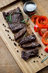Well-done grilled machete steak with salt, pepper and rosemary