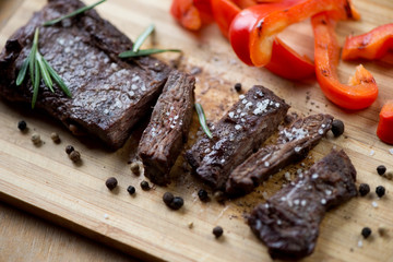 Close-up of sliced well-done grilled beef steak machete