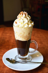 Viennese coffee in glass cup with whipped cream