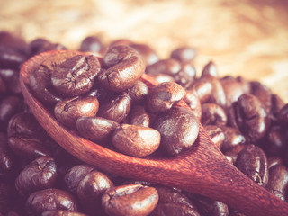 Coffee beans in wooden spoon 