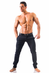 Fototapeta premium Shirtless musculeman with elegant pants, standing, isolated