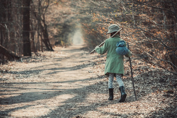 little girl  in the forest photo 