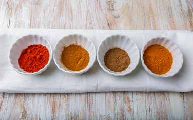 Various kinds of spices on wooden table