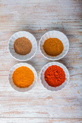 Various kinds of spices on wooden table