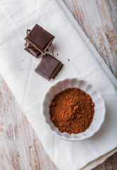 Cube of chocolate and a bowl of cocoa