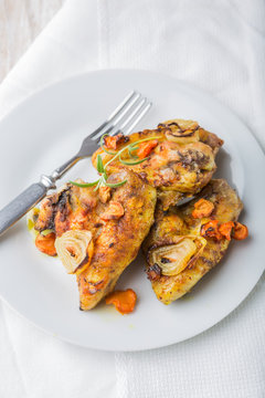 Oven-baked chicken wings with vegetables