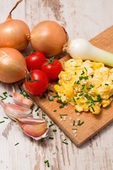 Vertical photo of Scrambled eggs and various vegetable