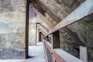 Fototapeta na wymiar Industrial background of rusty old concrete construction