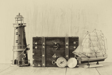 antique compass, vintage lighthouse, wooden boat