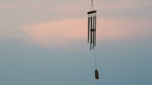 wind chime tube mobile in breeze.