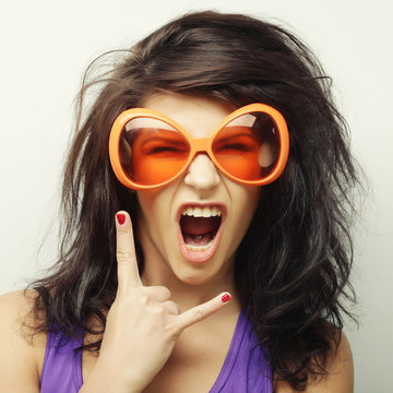 young woman with big orange sunglasses