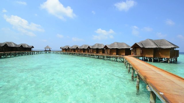 Over water bungalows with steps into amazing green lagoon