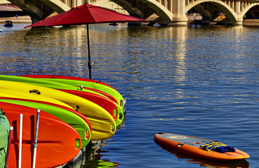 Kayaks Stacked on Dock in Water
