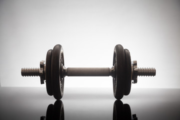dumbbell on a shiny surface
