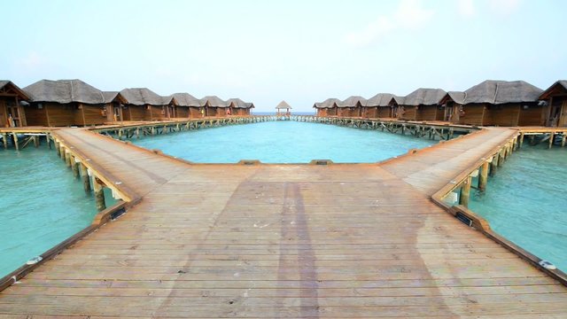Over water bungalows with steps into amazing green lagoon