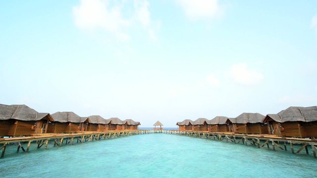 Over water bungalows with steps into amazing green lagoon