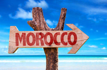Morocco wooden sign with beach background