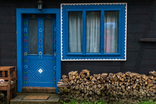 Traditional Wooden House With Blue Door