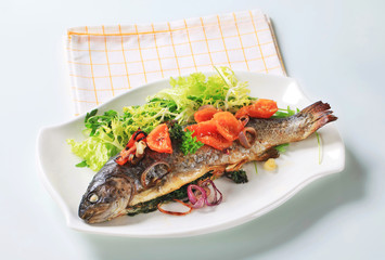 Baked trout with tomatoes and green salad