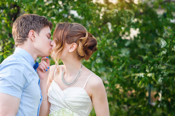 Bride and Groom walking Outdoors on spring in green park