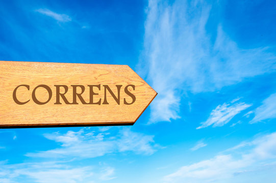 Wooden arrow sign pointing destination CORRENS, FRANCE