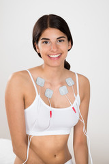 Happy Woman With Electrodes On Her Chest