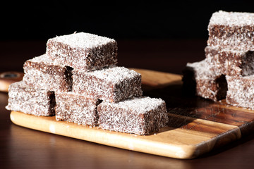 Group of Lamingtons with a dark background.