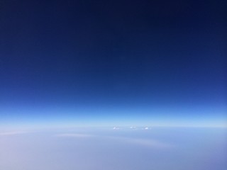 Naklejka na ściany i meble clear blue sky from airplane window