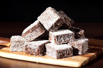 Group of Lamingtons with a dark background.