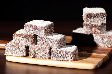 Group of Lamingtons with a dark background.