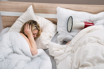 Couple With Duvet In Bedroom