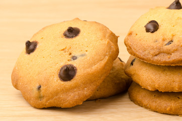 Homemade chocolate chip cookies on wooden background