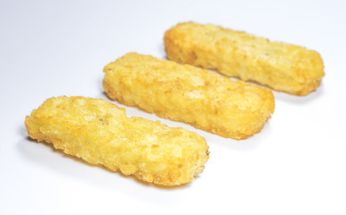 Hash brown pattie on white background..