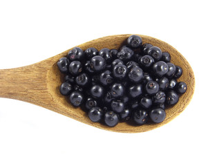 Jambolan plum or Java plum on wooden spoon