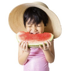 Lovely kid eating watermelon in studio