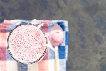 Berry smoothie glass on a napkin