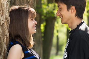 man and woman walking in nature