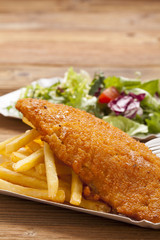 Fried fish and chips on a paper tray