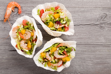 Shrimp salad with grapefruit, orange and roasted peanuts. - Serv