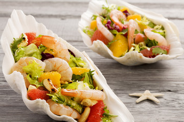 Shrimp salad with grapefruit, orange and roasted peanuts. - Serv
