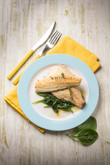 fish fillet with fresh spinach