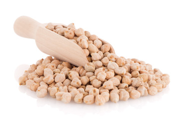 Uncooked chickpeas and wooden scoop