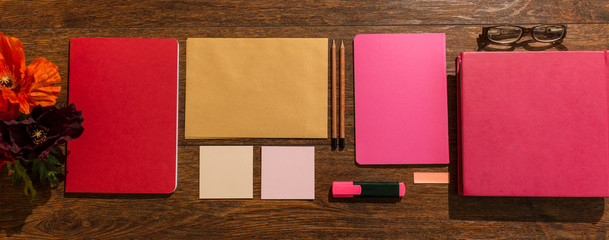 Pink notebooks on desk