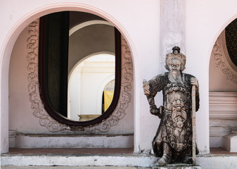 Arch and Chinese statue at Wat Phra Pathom Chedi