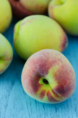 group of fresh peaches on wood background