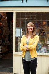 Portrait Of Owner Standing Outside Gift Shop