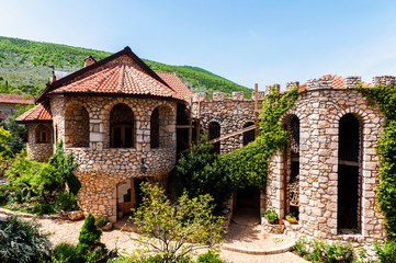 Fototapeta na wymiar Architectural details of the stone castle in Mediterranean style