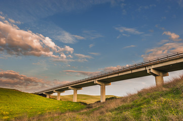 The bridge stretched between two hills in Tuscany